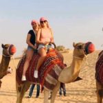 Tourist doing Camel Ride during Dubai Desert Safari