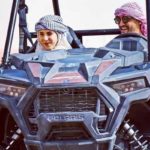 Couple Riding Dune Buggy