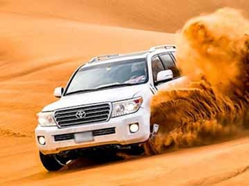 Dune Bashing at Evening Desert Safari Dubai Tour