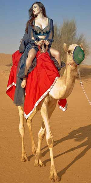 Women is Riding Camel at Desert Safari Dubai Tour