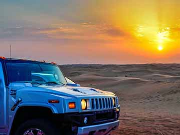Hummer in Arabian Desert at Evening