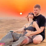 Tourist Couple Photo during Sunset in Dubai Desert