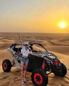 Tourist Girl Standing in front of 2-seater Dune Buggy Dubai Tour