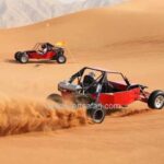 2 Red Dune Buggies during Desert Safari Tour