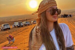 tourist girl during sunset photography at dubai desert safari