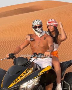 Tourist Couple during Quad Bike Ride Dubai
