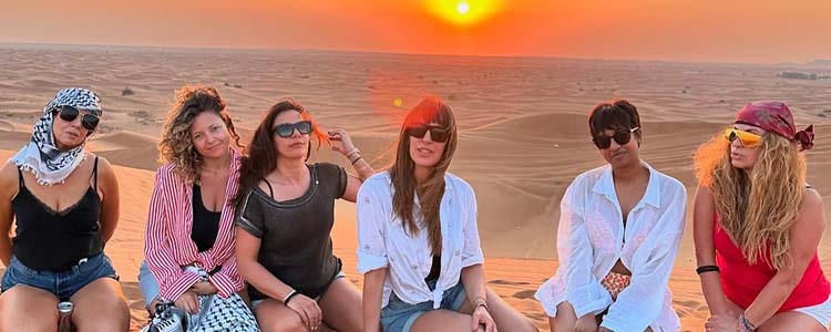 The Ultimate Guide to Desert Safari Dubai Booking - Group of Tourists in the Arabian Desert